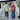 Two men walking outdoors in Da Vinci California camp shirts - one in a color-block style, the other in a Koi-print shirt and cowboy hat.
