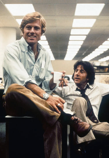 Robert Redford (left) in a button-down shirt and Dustin Hoffman (right) in "All President's Men", 1976. Image through Everett Collection.