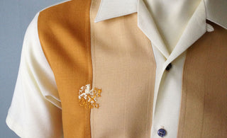 Cropped photo of a vintage Da Vinci California Off White, Rust and Beige color blocked shirt. Photo borrowed from https://www.decadesvintage.com