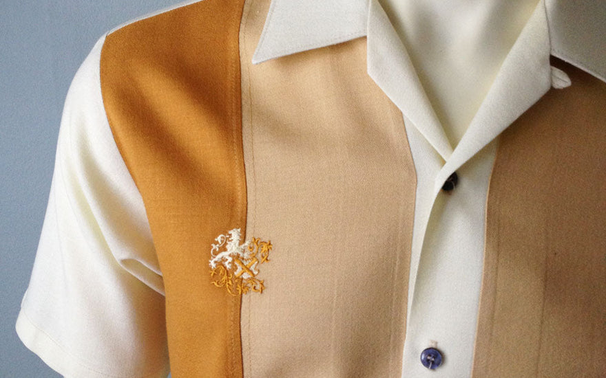 Cropped photo of a vintage Da Vinci California Off White, Rust and Beige color blocked shirt. Photo borrowed from https://www.decadesvintage.com